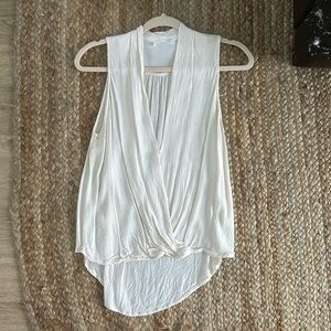 Flowy cream sleeveless top with longer back